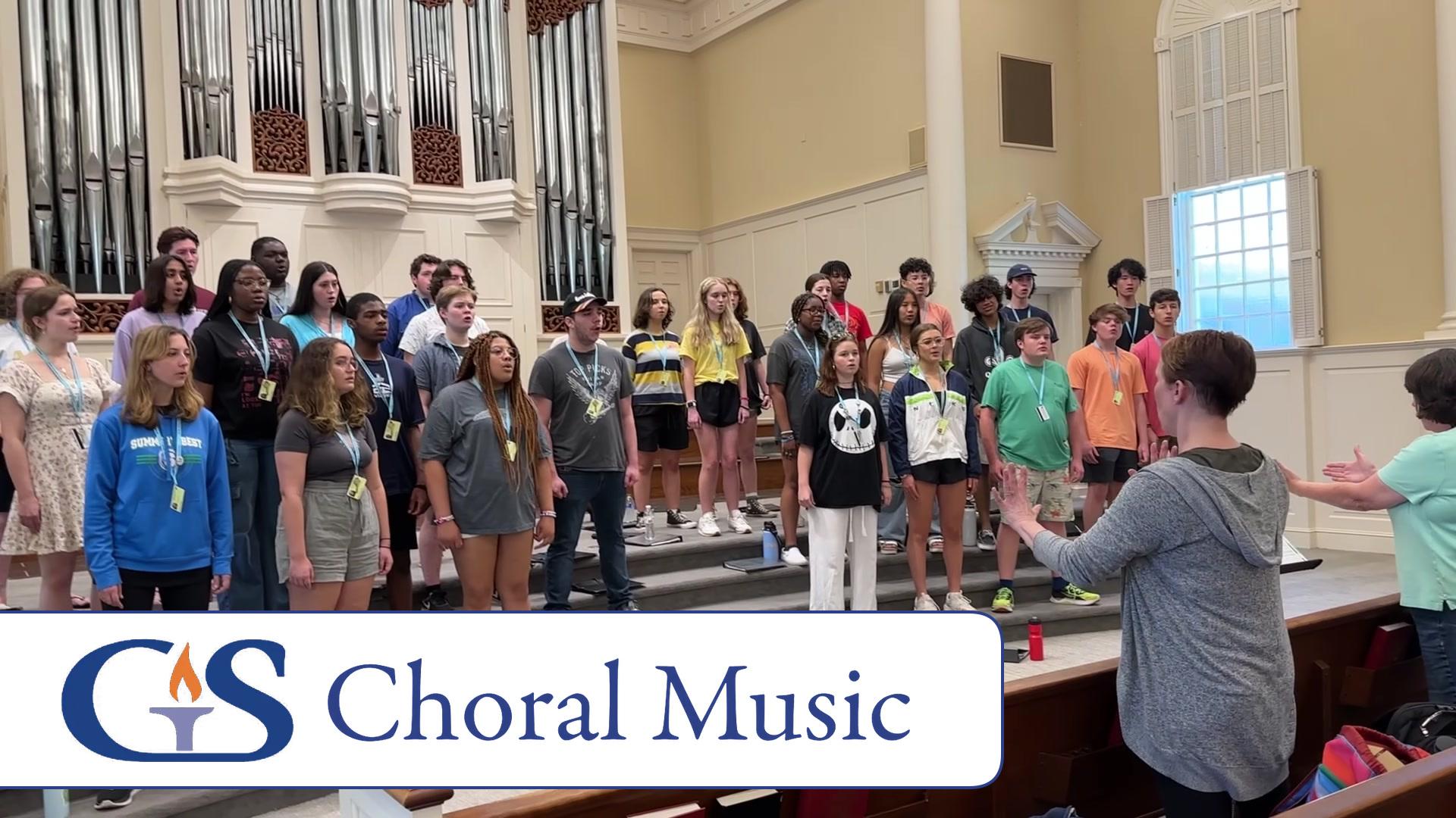 Governor’s School choir rehearsing with a conductor