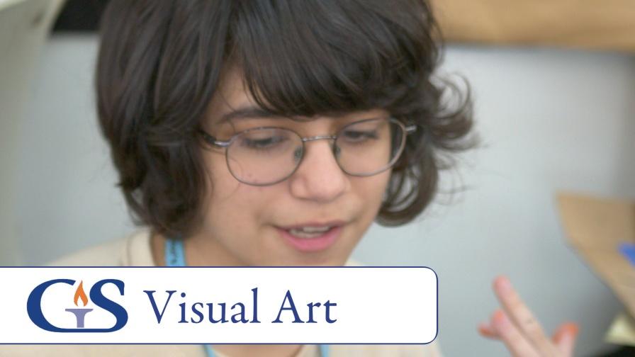 Governor’s School visual art student smiling and holding a paintbrush